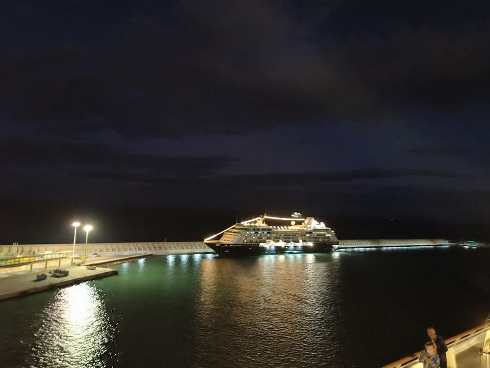 Málaga port at night with illuminated boats